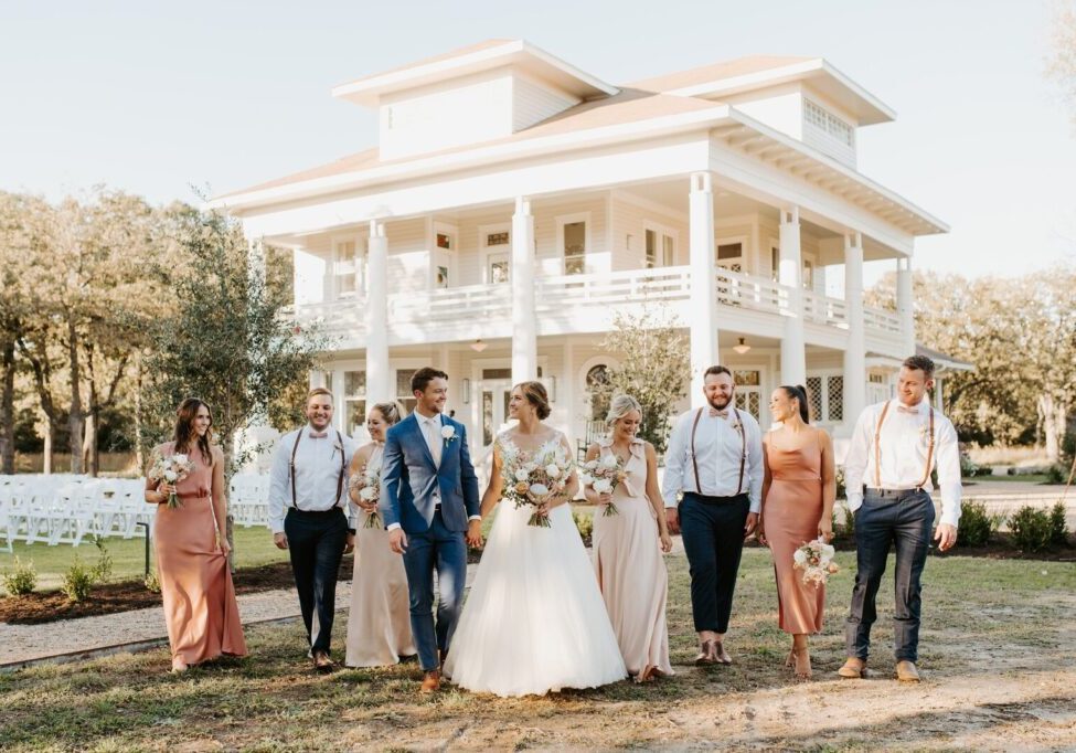 A group of people standing next to each other smiling