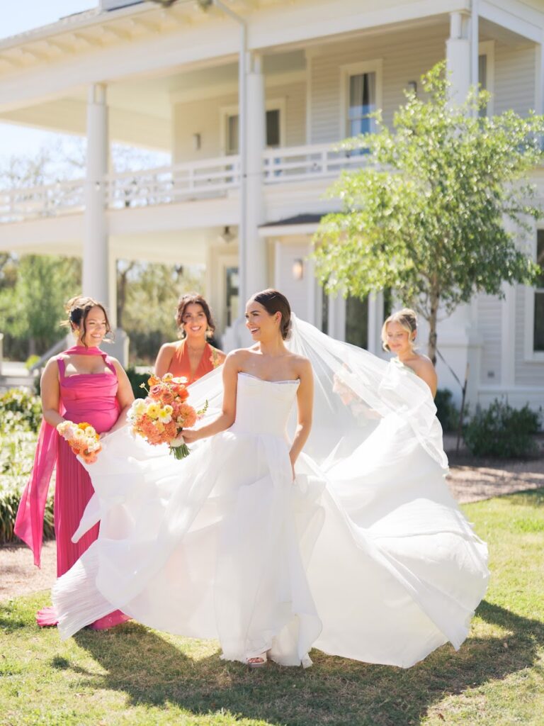 Friday wedding in Austin — bride on the wraparound porch at golden hour at The Grand Lady.